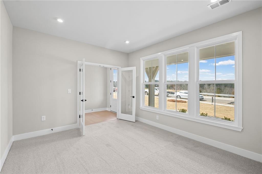 714 Conley Drive Canton, GA 30115 - Photo 21 of 51 a view of an empty room with a window