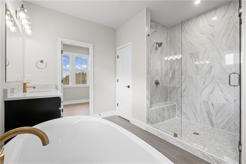 714 Conley Drive Canton, GA 30115 - Photo 26 of 51 a bathroom with a sink and a shower
