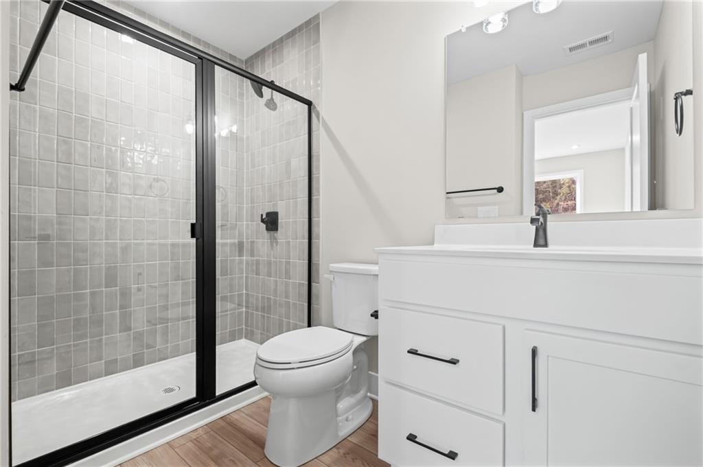 714 Conley Drive Canton, GA 30115 - Photo 30 of 51 a bathroom with a shower a toilet and a sink
