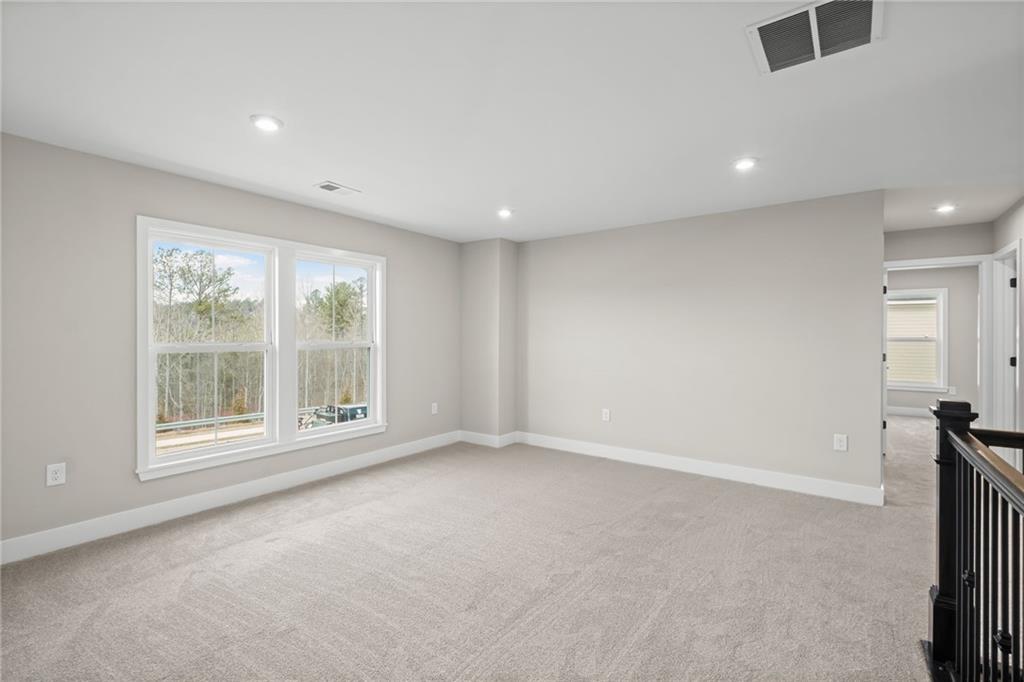 714 Conley Drive Canton, GA 30115 - Photo 34 of 51 an empty room with a empty space and windows
