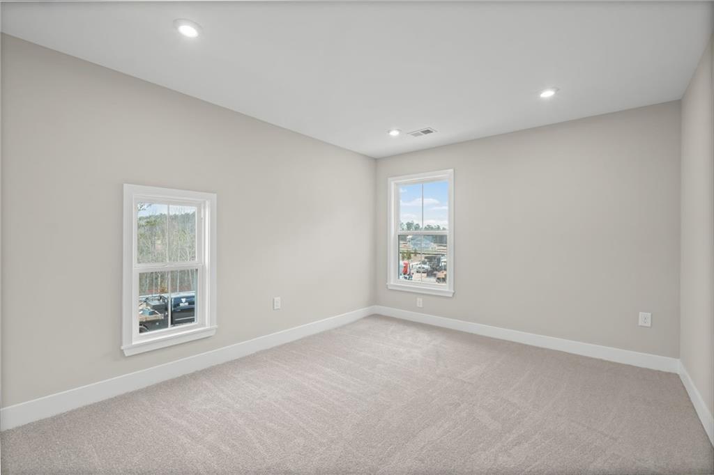 714 Conley Drive Canton, GA 30115 - Photo 36 of 51 an empty room with windows