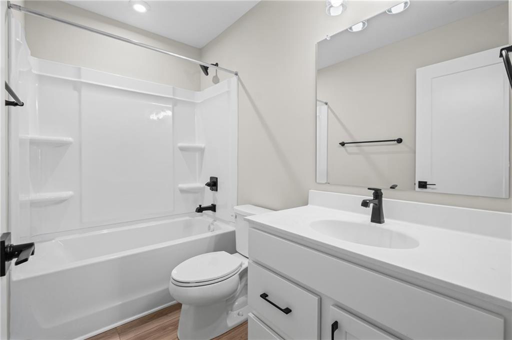 714 Conley Drive Canton, GA 30115 - Photo 40 of 51 a bathroom with a sink a toilet and a bathtub
