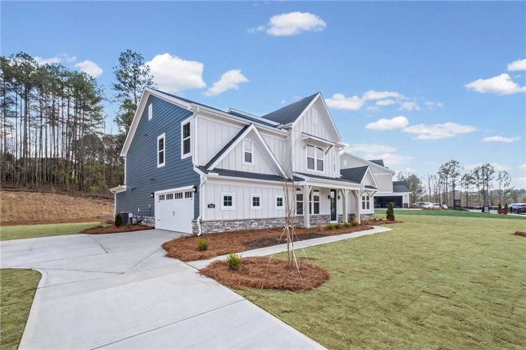 714 Conley Drive Canton, GA 30115 - Photo 4 of 51 a front view of a house with a yard and trees