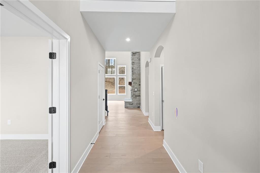 714 Conley Drive Canton, GA 30115 - Photo 8 of 51 a view of a hallway with wooden floor and cabinet