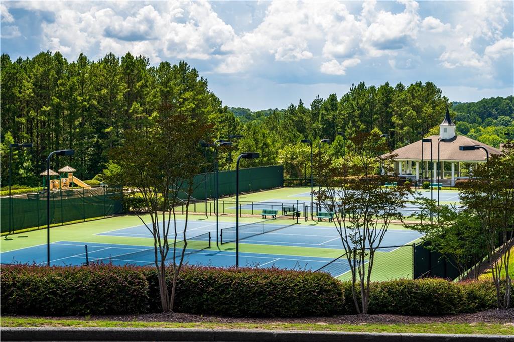 714 Conley Drive Canton, GA 30115 - Photo 8 of 8 a view of a house with a yard and table and chairs under an umbrella