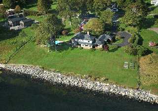 Undisclosed Address Darien, CT 06820 - Photo 2 of 8 a view of a garden with a bench