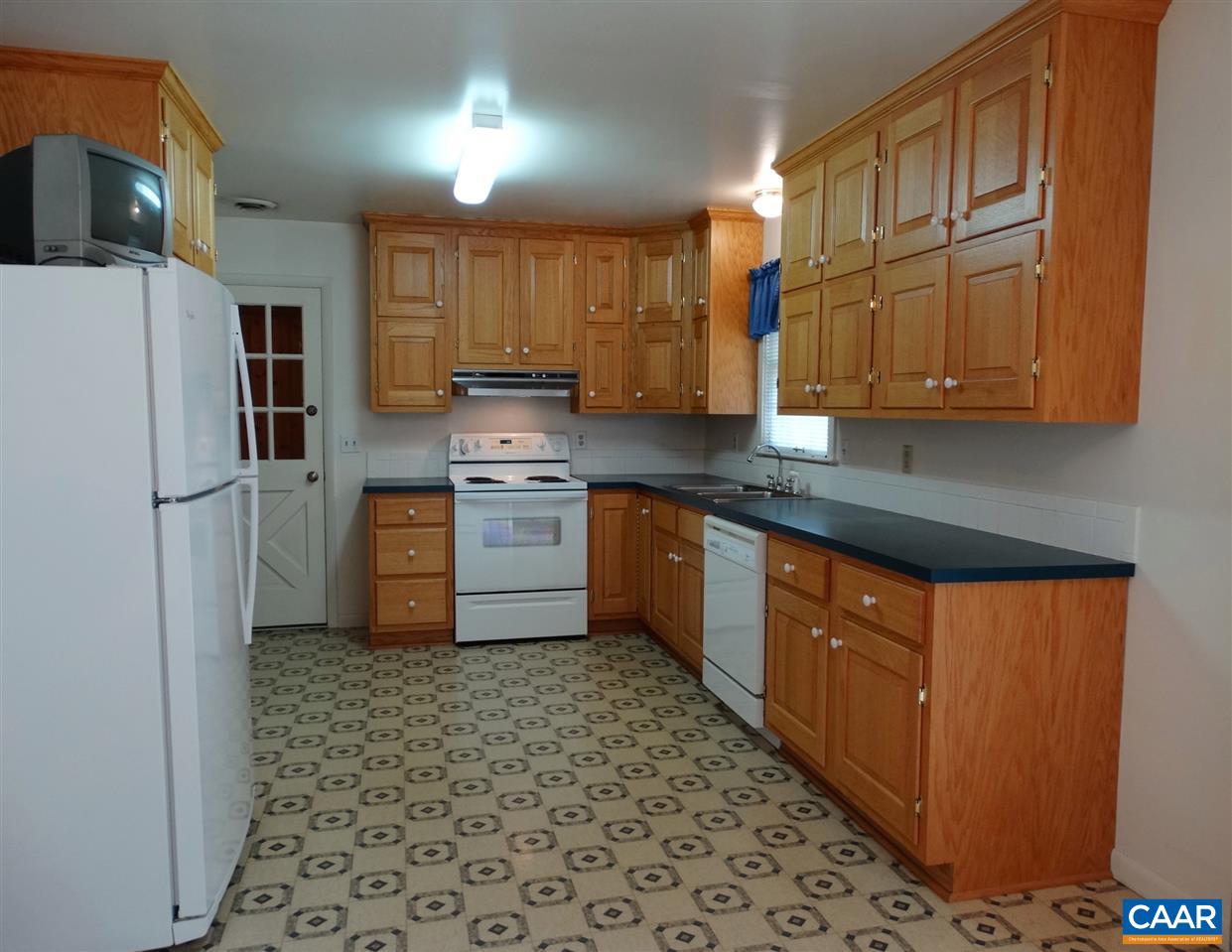 992 Advance Mills Road Ruckersville, VA 22968 - Photo 16 of 34 a kitchen with stainless steel appliances granite countertop a sink stove and refrigerator