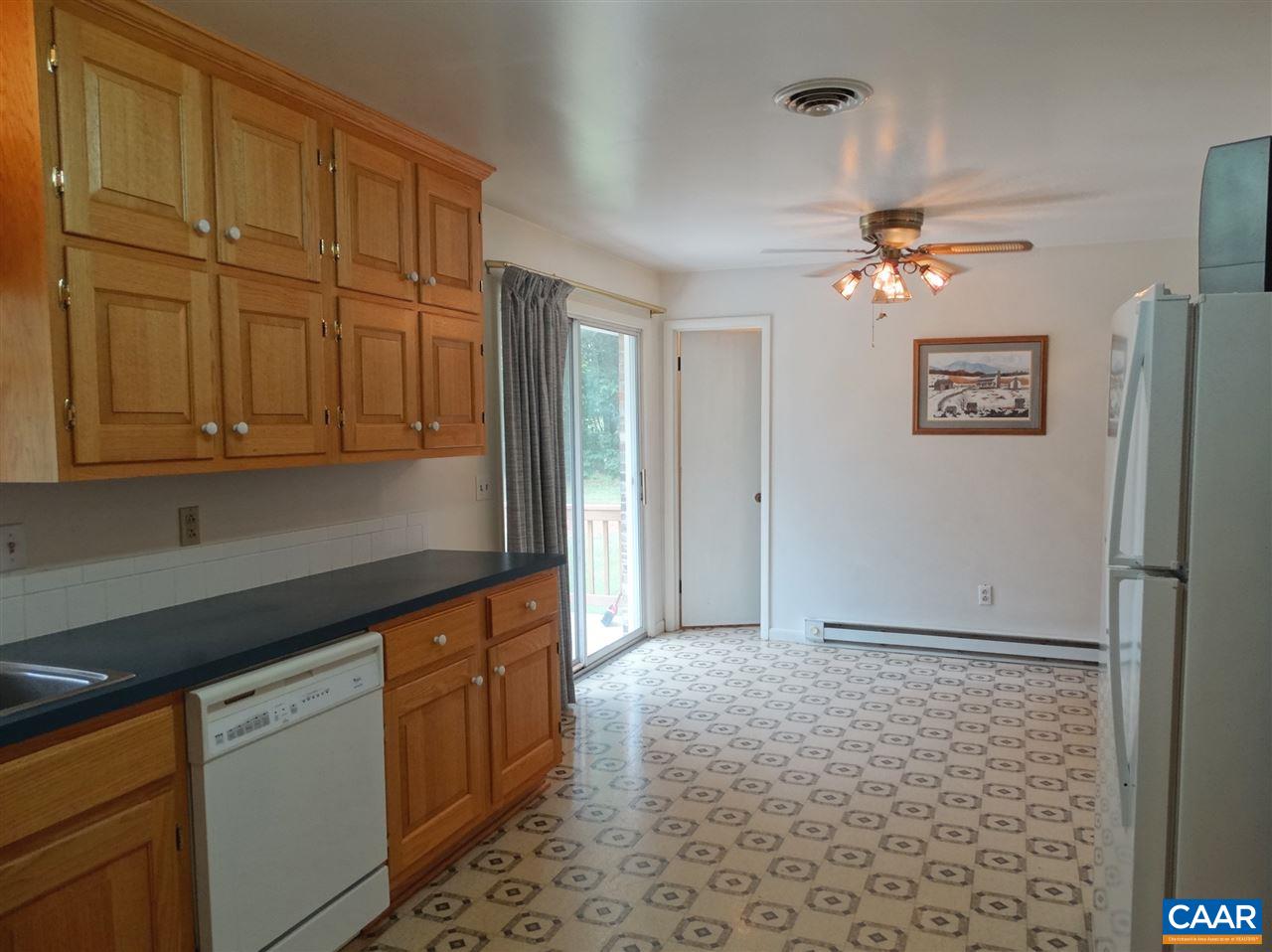 992 Advance Mills Road Ruckersville, VA 22968 - Photo 18 of 34 a kitchen with stainless steel appliances granite countertop a refrigerator a sink and dishwasher with granite countertops