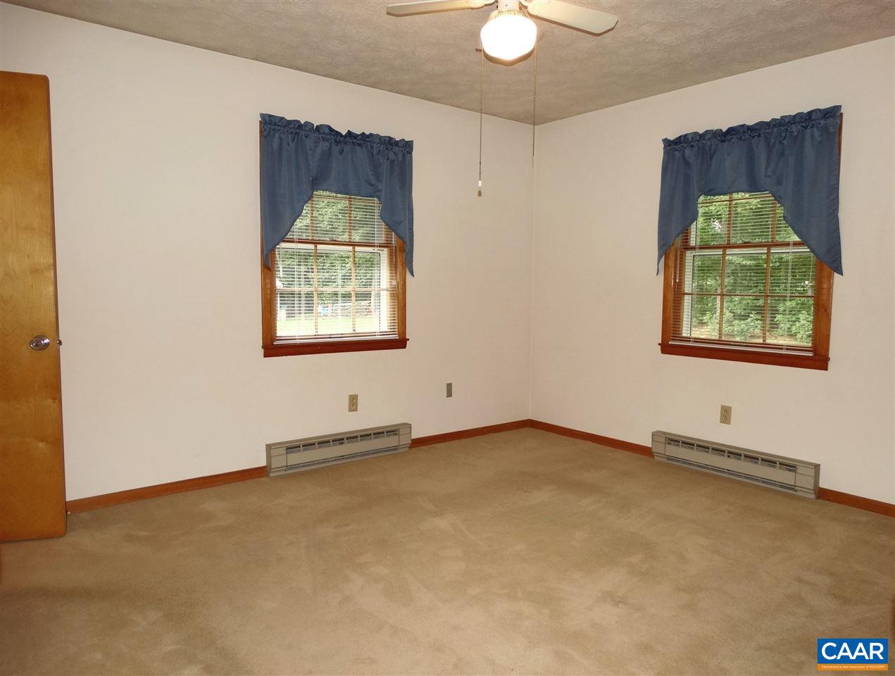 992 Advance Mills Road Ruckersville, VA 22968 - Photo 19 of 34 an empty room with windows