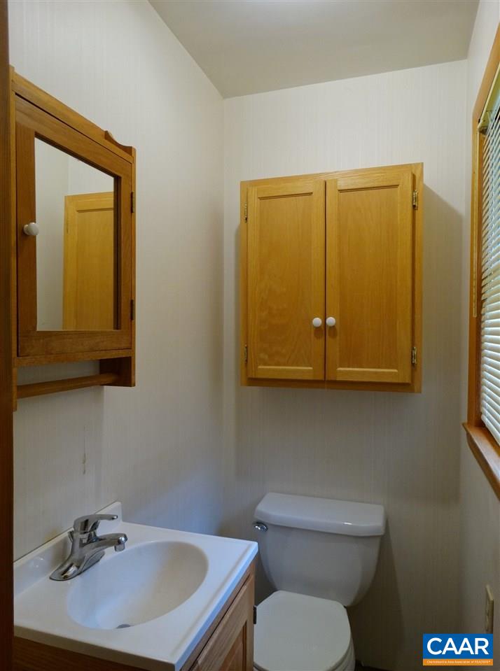 992 Advance Mills Road Ruckersville, VA 22968 - Photo 21 of 34 a bathroom with a toilet sink and mirror
