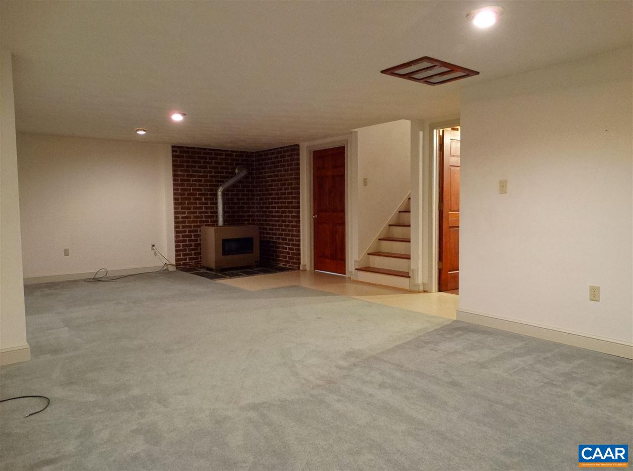 992 Advance Mills Road Ruckersville, VA 22968 - Photo 26 of 34 a view of an empty room with closet and stairs
