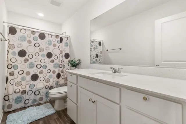 a spacious bedroom with a bed and a window