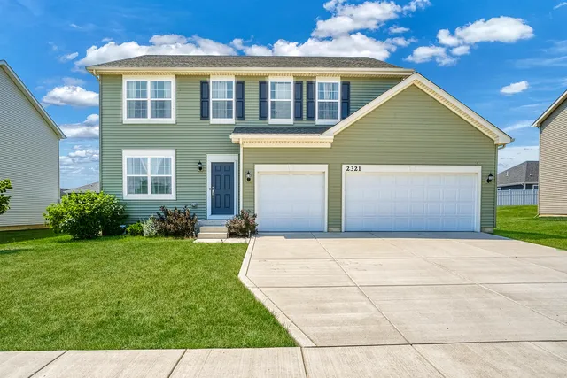 front view of a house with potted plants