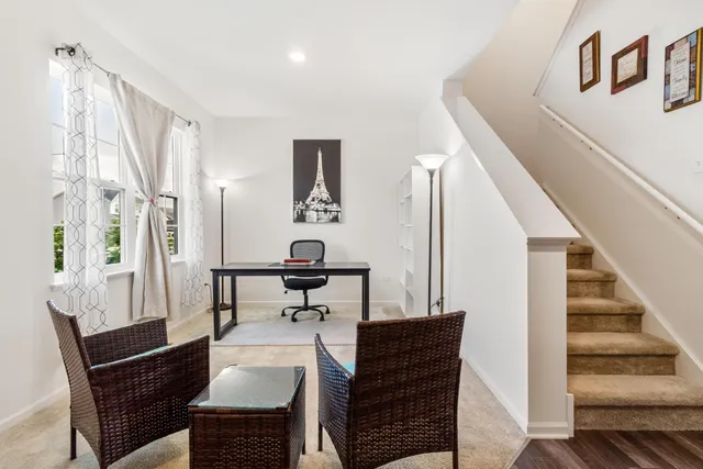 a view of hallway with furniture
