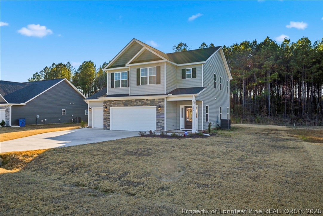 106 Knotts Berry Road Bunnlevel, NC 28323 - Photo 2 of 50 a view of a house with a yard and a large tree