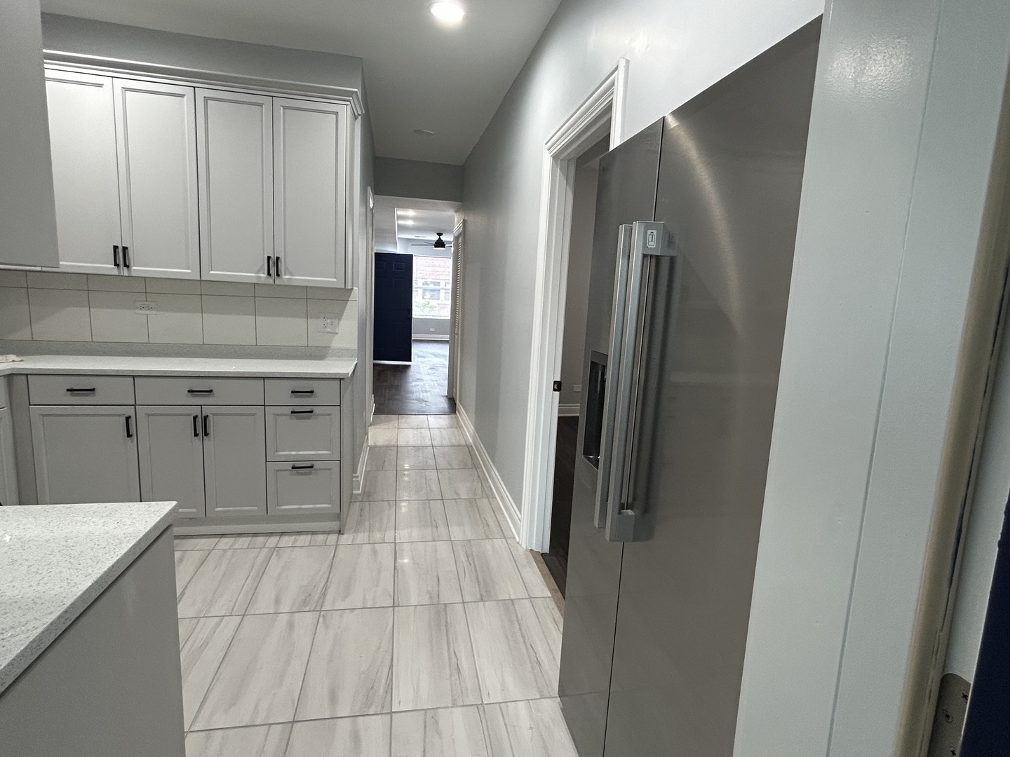 7940 South Carpenter Street, Unit 2 Chicago, IL 60620 - Photo 23 of 34 a kitchen with stainless steel appliances granite countertop a refrigerator and a sink