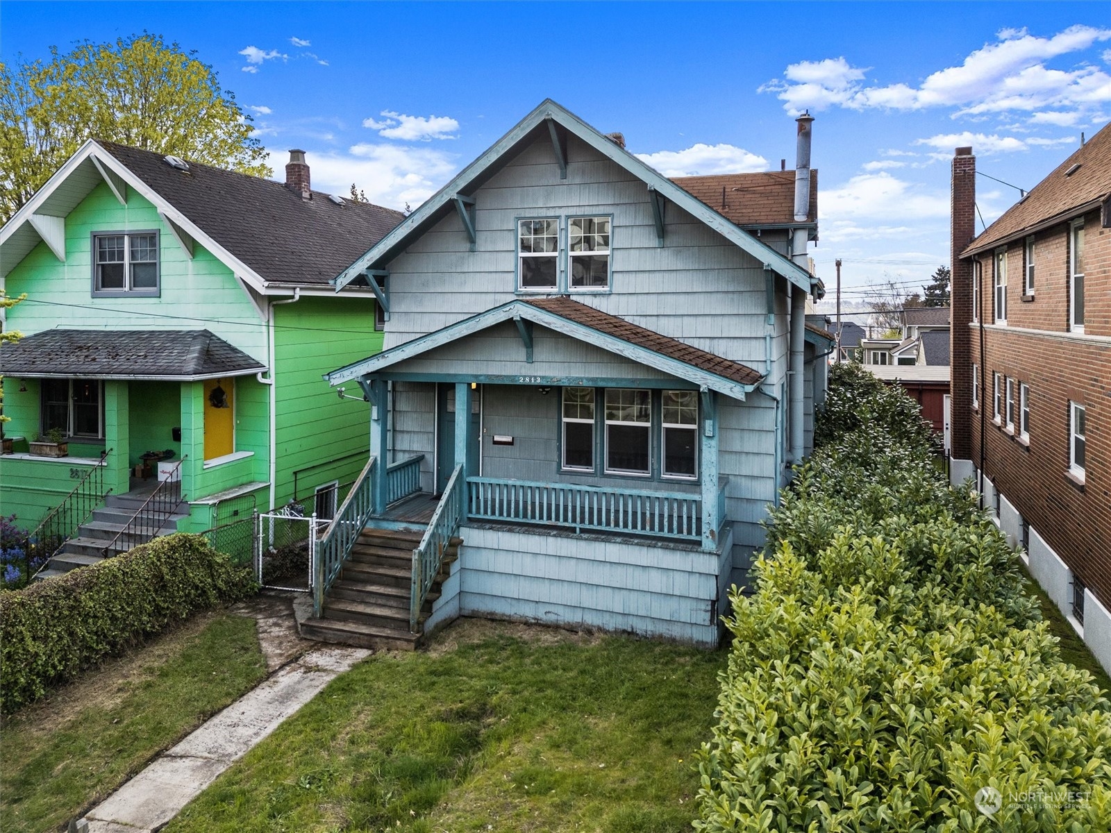 2813 15th Avenue South Seattle, WA 98144 - Photo 1 of 32 a front view of a house with a yard