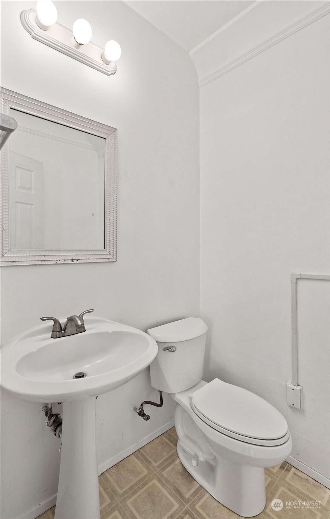 2813 15th Avenue South Seattle, WA 98144 - Photo 14 of 32 a bathroom with a sink a toilet and mirror