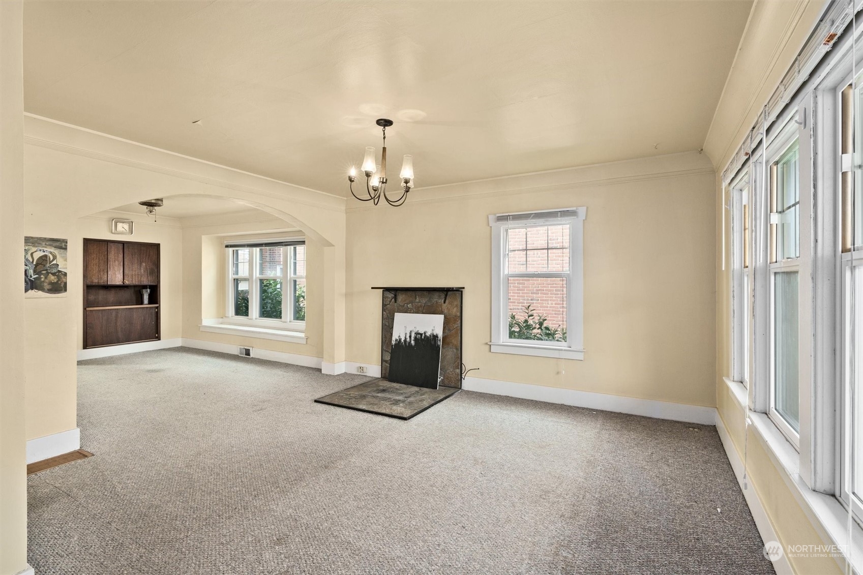 2813 15th Avenue South Seattle, WA 98144 - Photo 5 of 32 en empty room with windows and chandelier