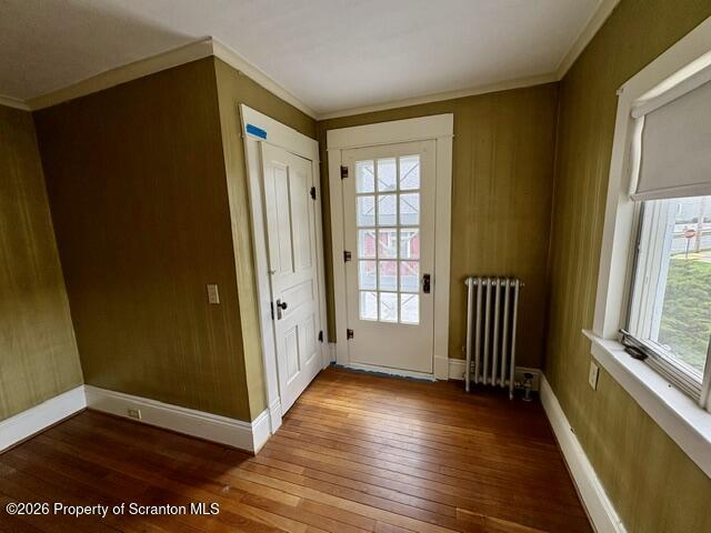 706 Delaware Street Forest City, PA 18421 - Photo 16 of 33 an empty room with wooden floor and windows