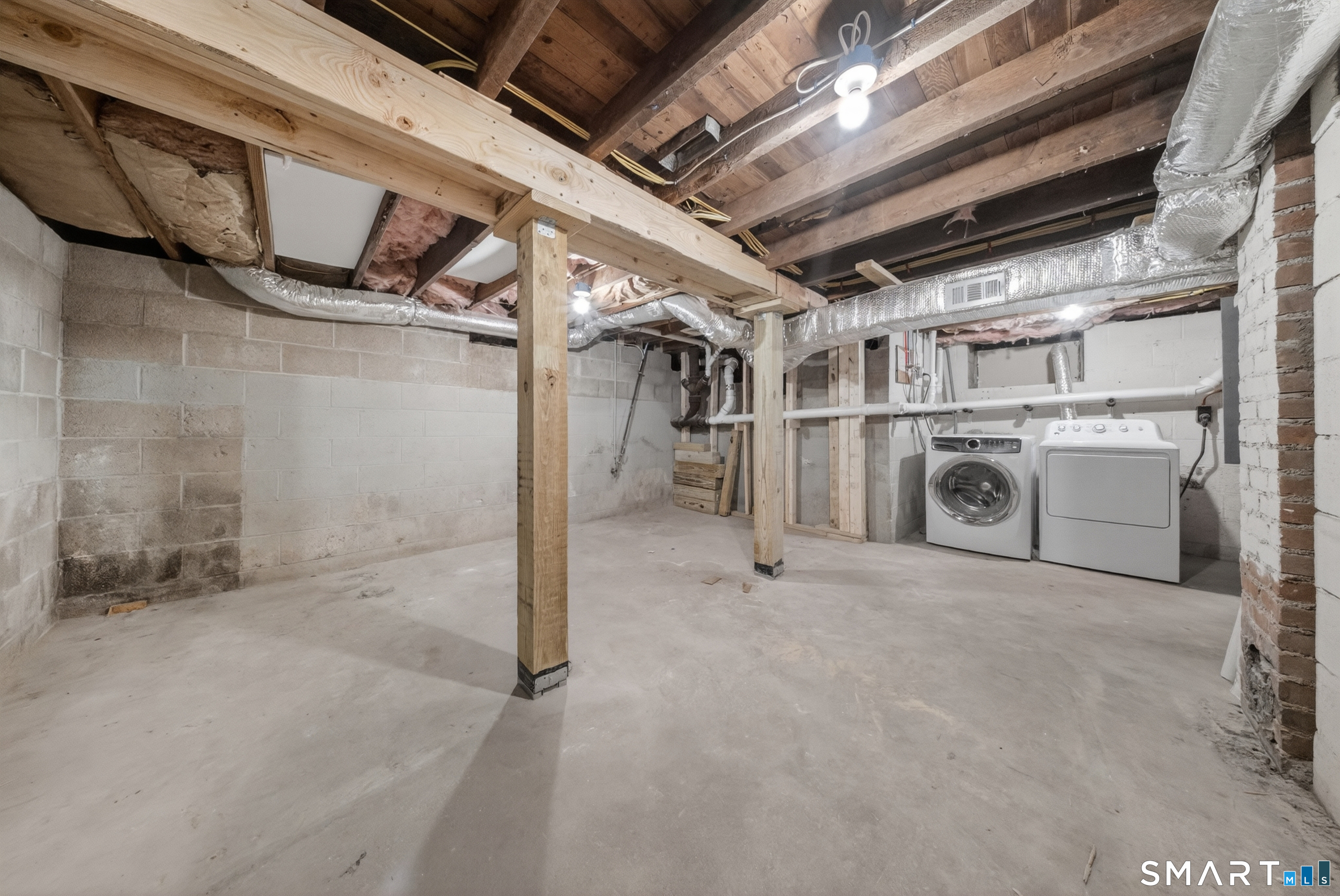207 Hillcrest Road Bridgeport, CT 06606 - Photo 18 of 28 Laundry and plenty of storage in the basement