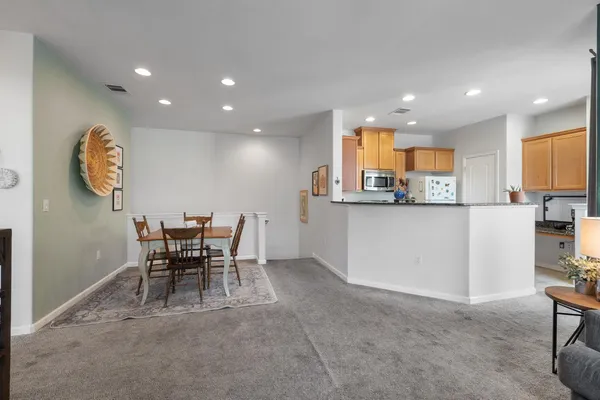 a kitchen with a table and chairs in it