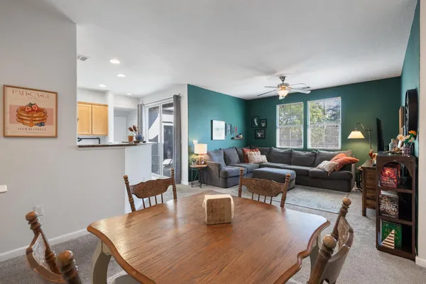 a living room with furniture and a table