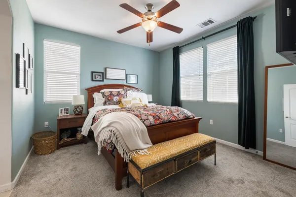 a bedroom with a bed and window