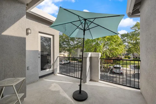 a view of a balcony with a potted plant