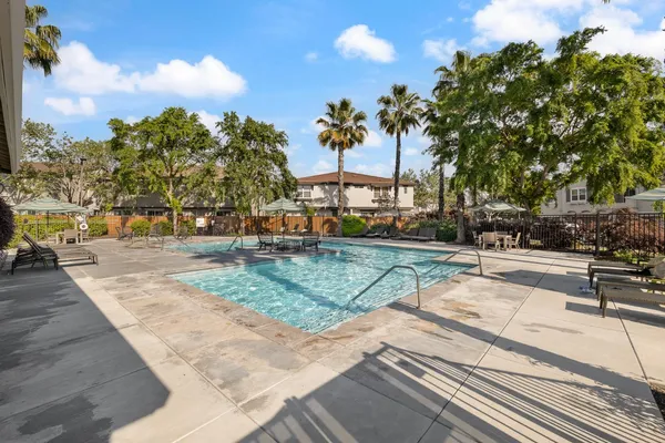 a view of a yard with cars park