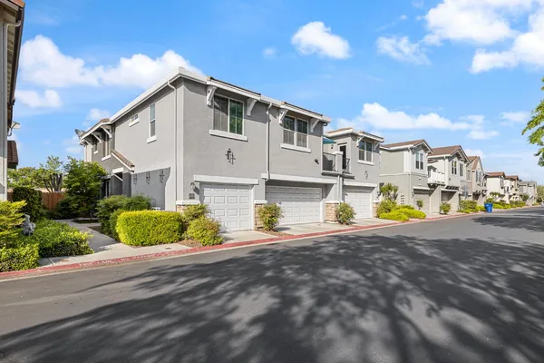 a view of a house with a outdoor space and sitting area