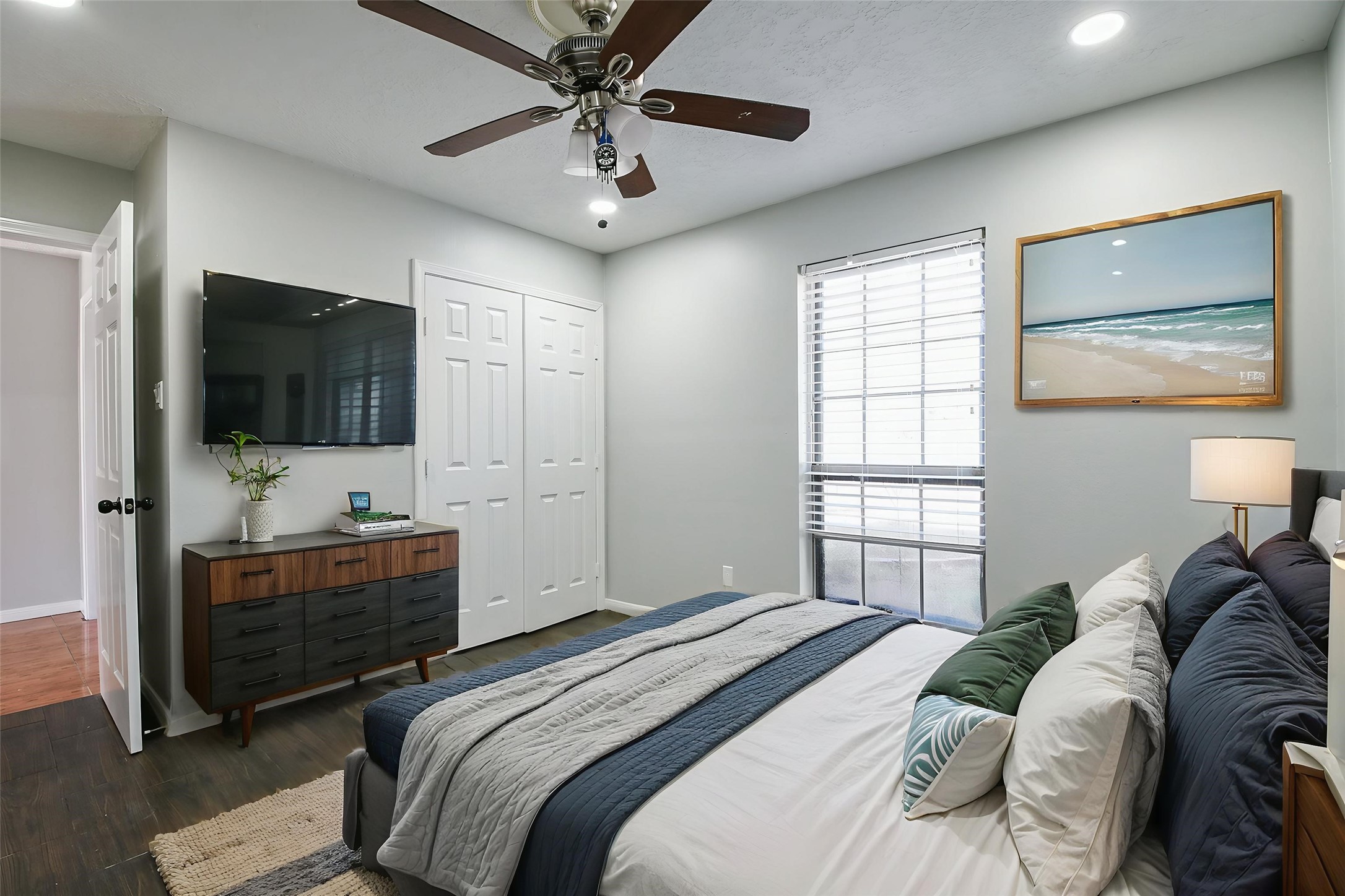 1007 Maranon Lane Houston, TX 77090 - Photo 18 of 36 Welcome to the cozy downstairs bedroom! It's a versatile space that doubles as a study, media room, or even a fun play area for the kids!