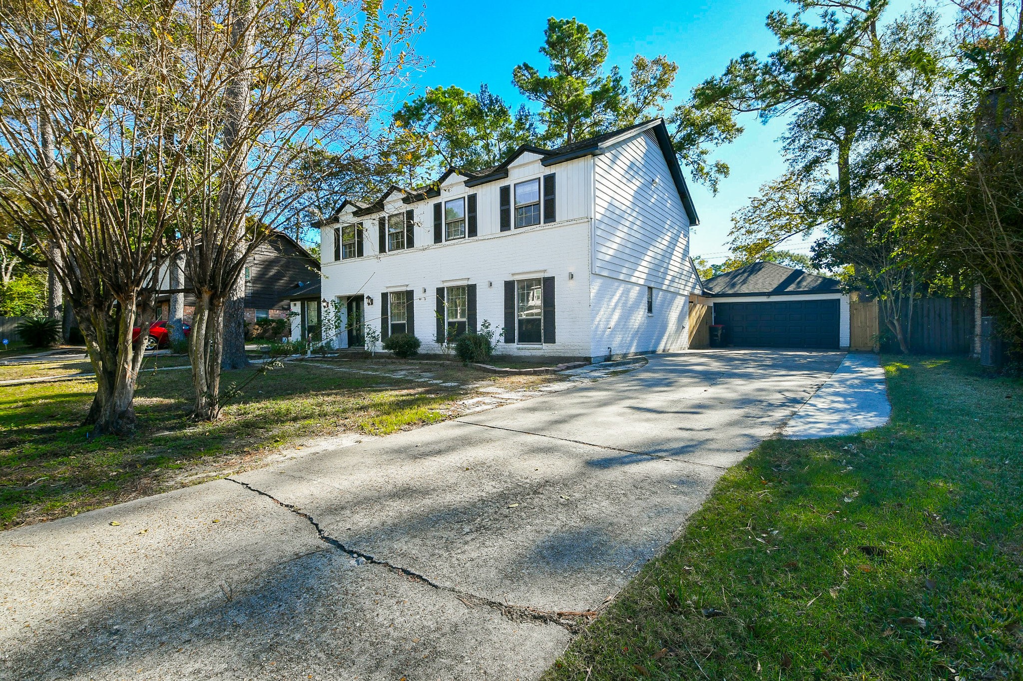 1007 Maranon Lane Houston, TX 77090 - Photo 3 of 36 You'll love the generous parking available on this long driveway, which happily leads you to a roomy two-car detached garage.