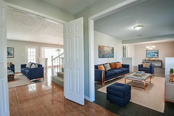 a living room with furniture window and a couch
