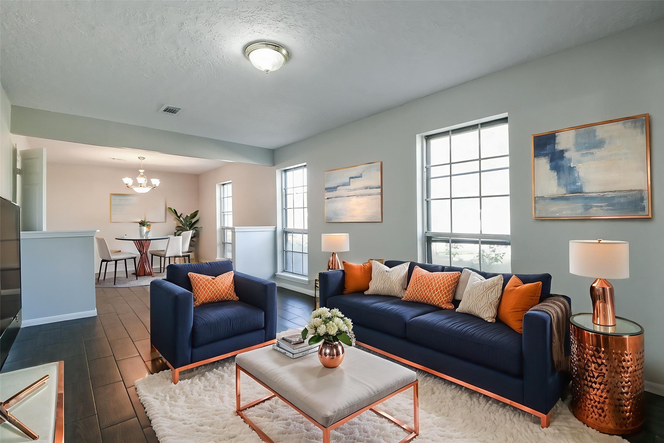 1007 Maranon Lane Houston, TX 77090 - Photo 6 of 36 Notice the beautiful, dark, wood flooring and the huge windows to allow natural light to stream through.