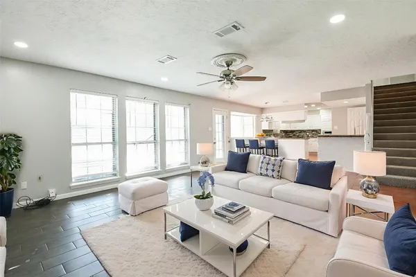 a living room with furniture and a large window