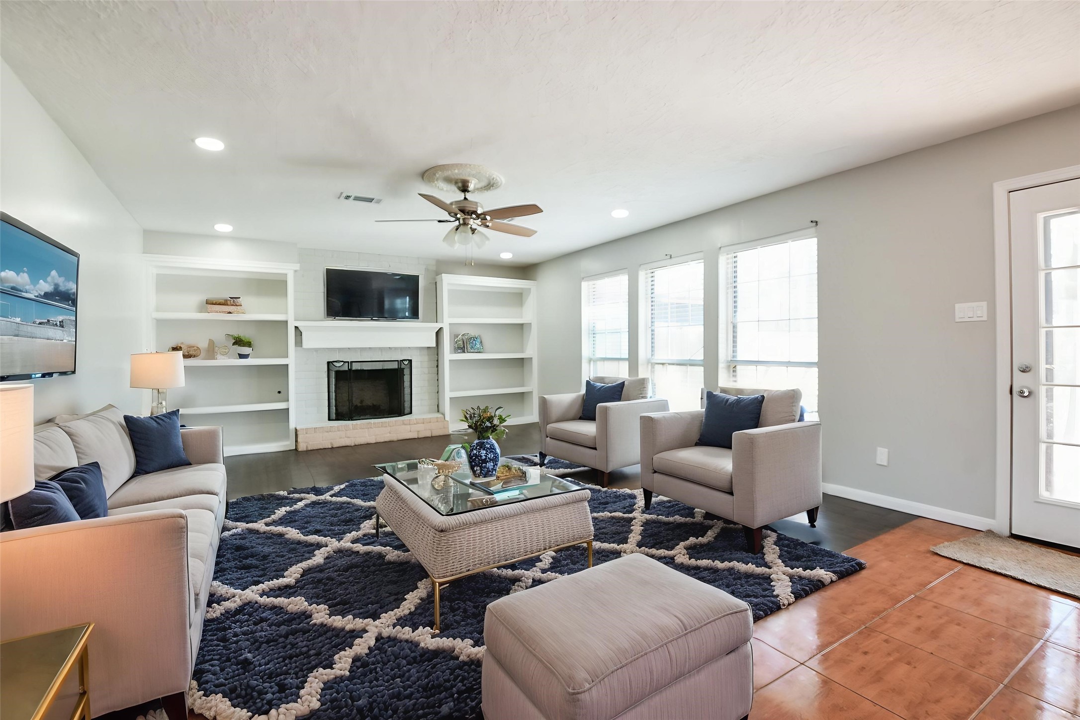 1007 Maranon Lane Houston, TX 77090 - Photo 9 of 36 Take a look at that gorgeous dark wood flooring and the charming white brick fireplace! Can you imagine all the wonderful holiday memories you’ll create in your new home?