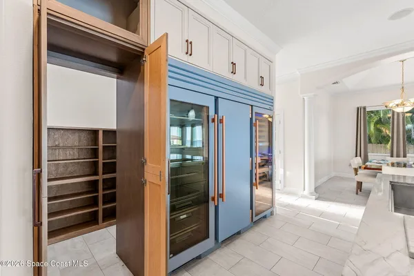 a view of walk in closet with empty racks