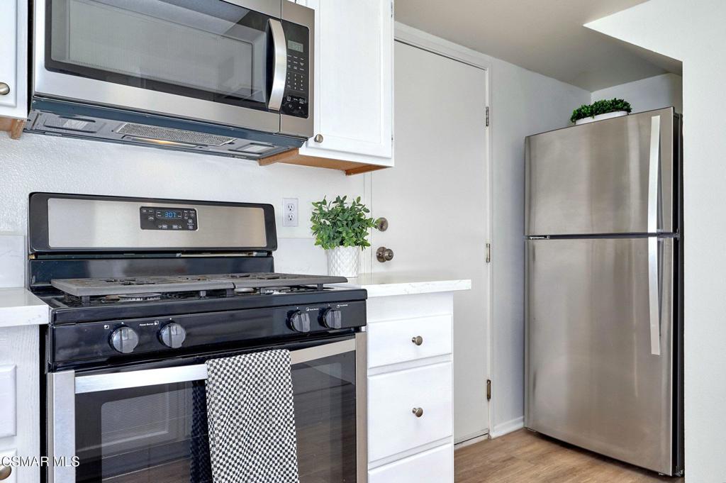 4508 Apricot Road, Unit B Simi Valley, CA 93063 - Photo 17 of 44 a kitchen with appliances cabinets and a counter top space