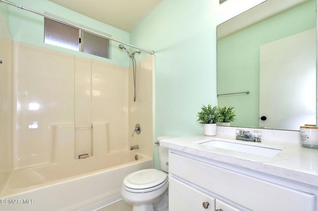 4508 Apricot Road, Unit B Simi Valley, CA 93063 - Photo 28 of 44 a bathroom with a granite countertop sink a toilet and shower
