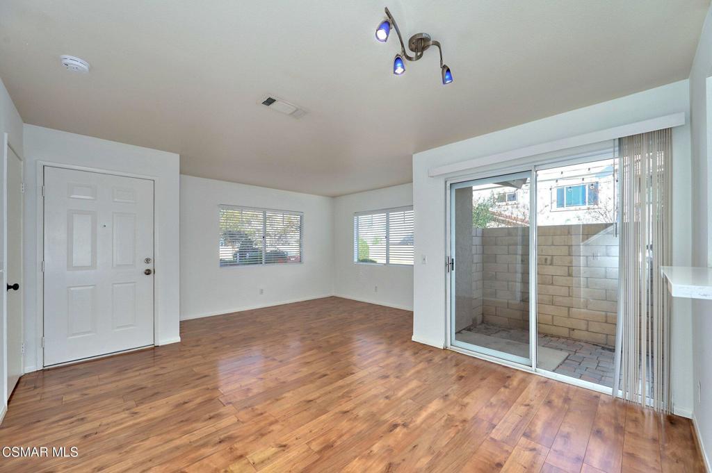 4508 Apricot Road, Unit B Simi Valley, CA 93063 - Photo 3 of 44 a view of an empty room with wooden floor and a window