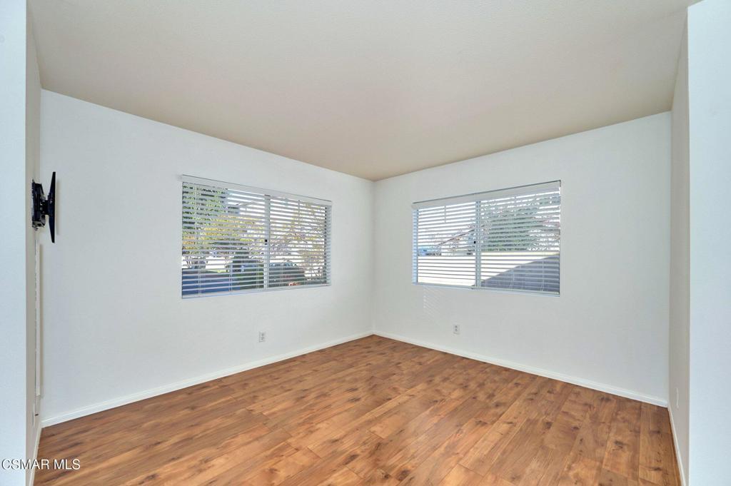 4508 Apricot Road, Unit B Simi Valley, CA 93063 - Photo 5 of 44 a view of an empty room with wooden floor and a window