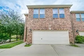 front view of a house with a garden