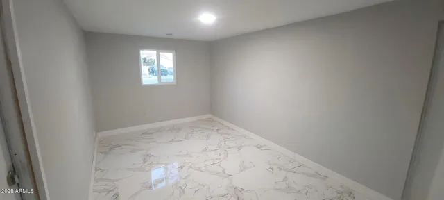 a white toilet sitting next to a bathroom sink