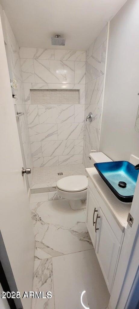 1826 North 73rd Avenue Phoenix, AZ 85035 - Photo 15 of 16 a bathroom with a sink a toilet and a shower