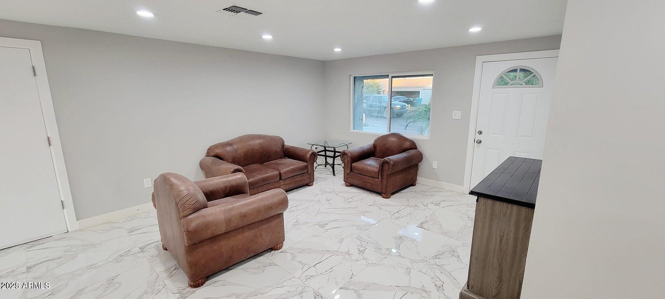 1826 North 73rd Avenue Phoenix, AZ 85035 - Photo 7 of 16 a living room with furniture