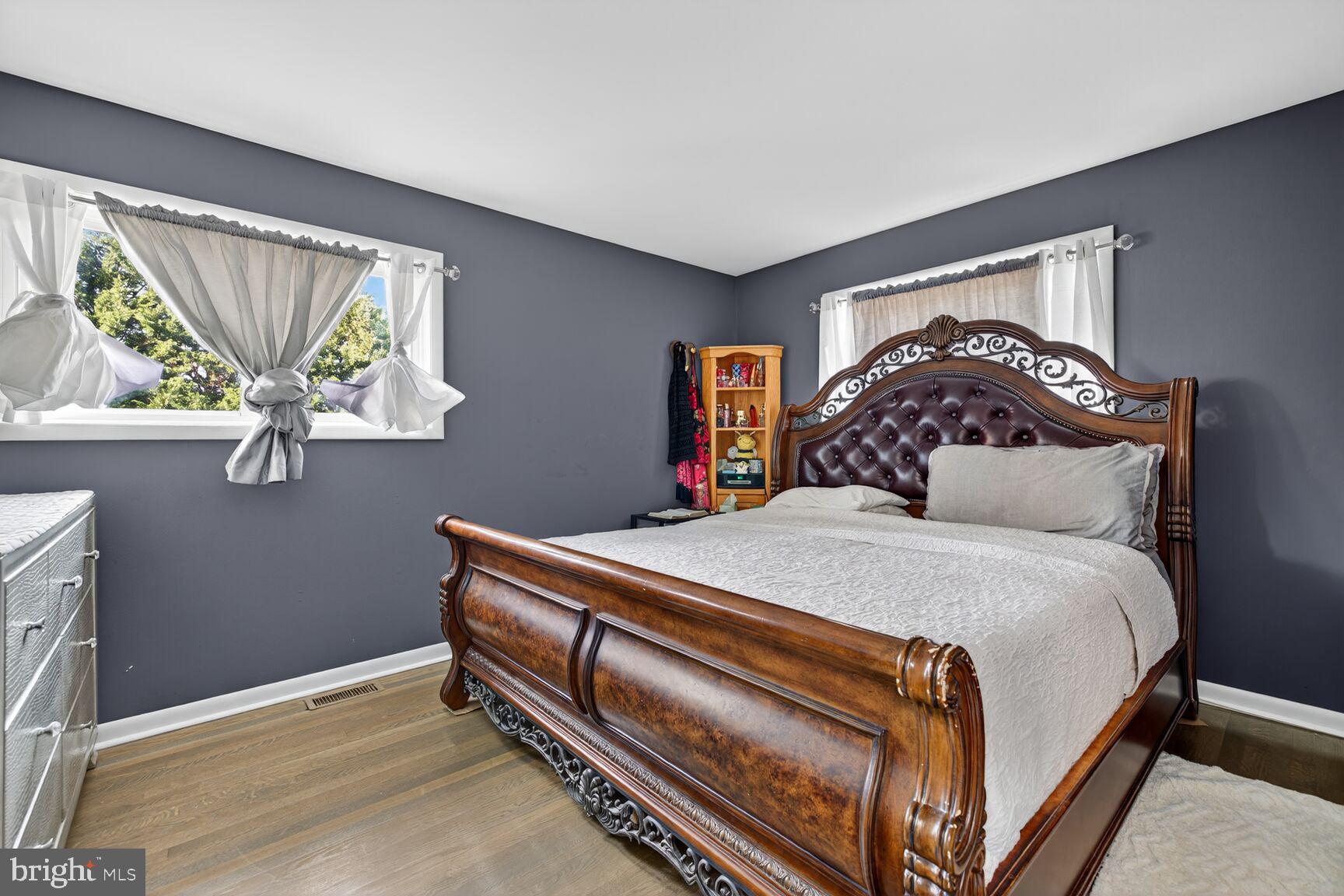 8418 Mapleville Road Boonsboro, MD 21713 - Photo 14 of 30 a bed sitting in a bedroom next to a window