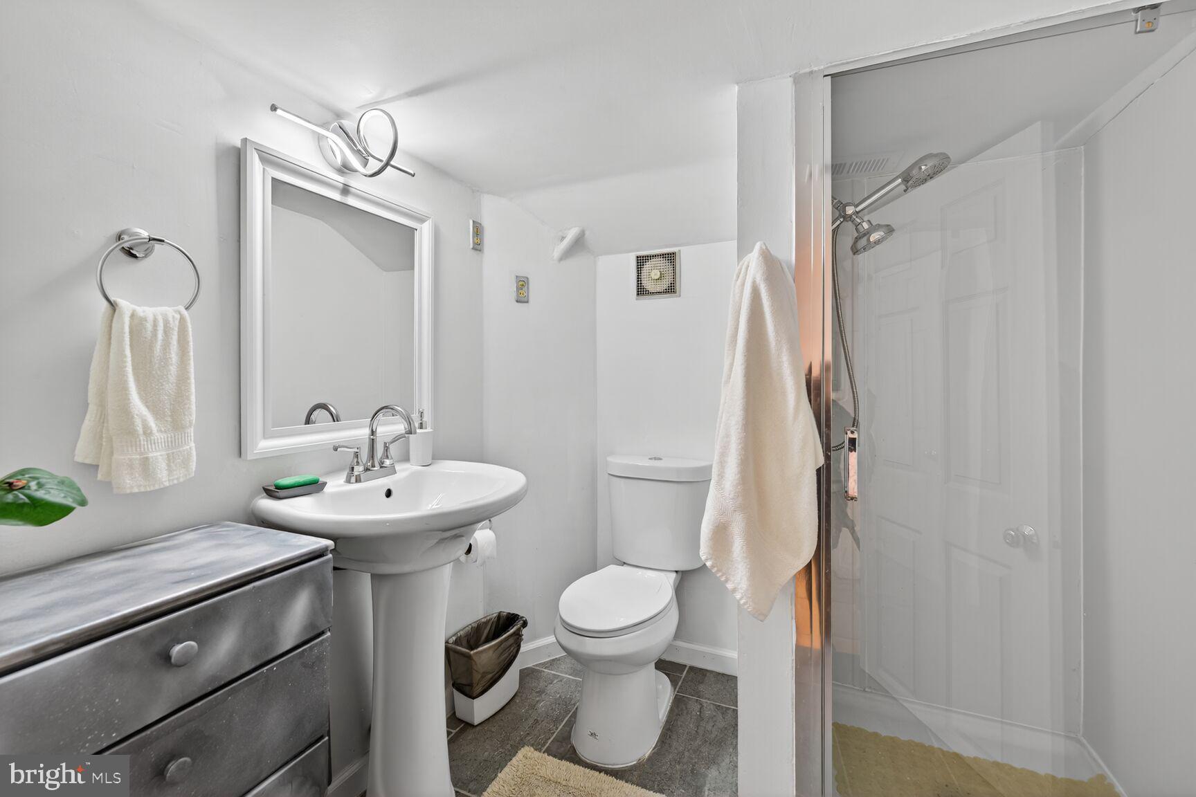 8418 Mapleville Road Boonsboro, MD 21713 - Photo 20 of 30 a bathroom with a toilet sink and mirror