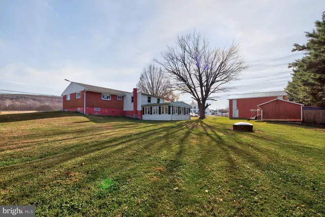 a view of a chairs and tables in the balcony