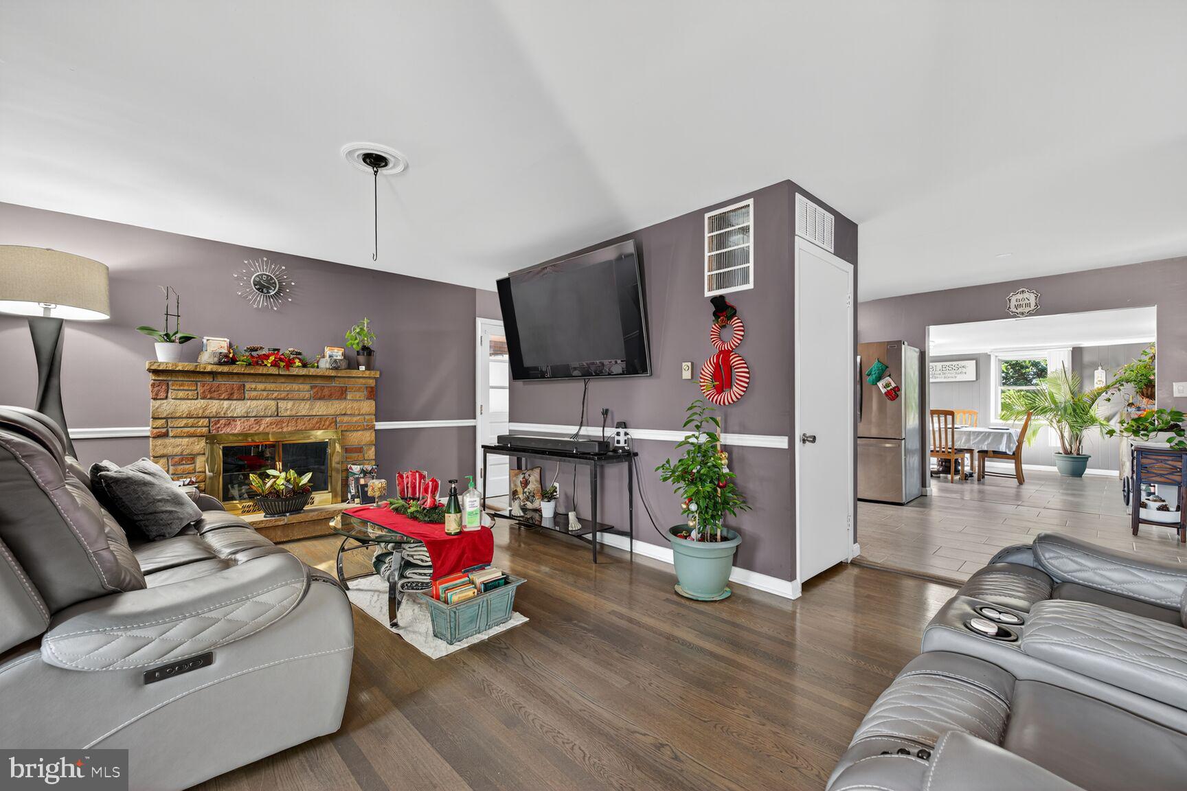8418 Mapleville Road Boonsboro, MD 21713 - Photo 5 of 30 a living room with furniture and a flat screen tv